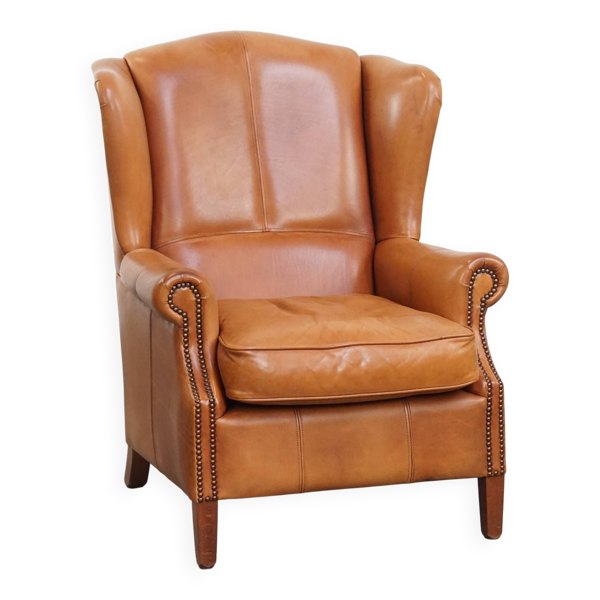 Fauteuil à oreilles en cuir de vache