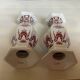 Pair of hexagonal burgundy candlesticks