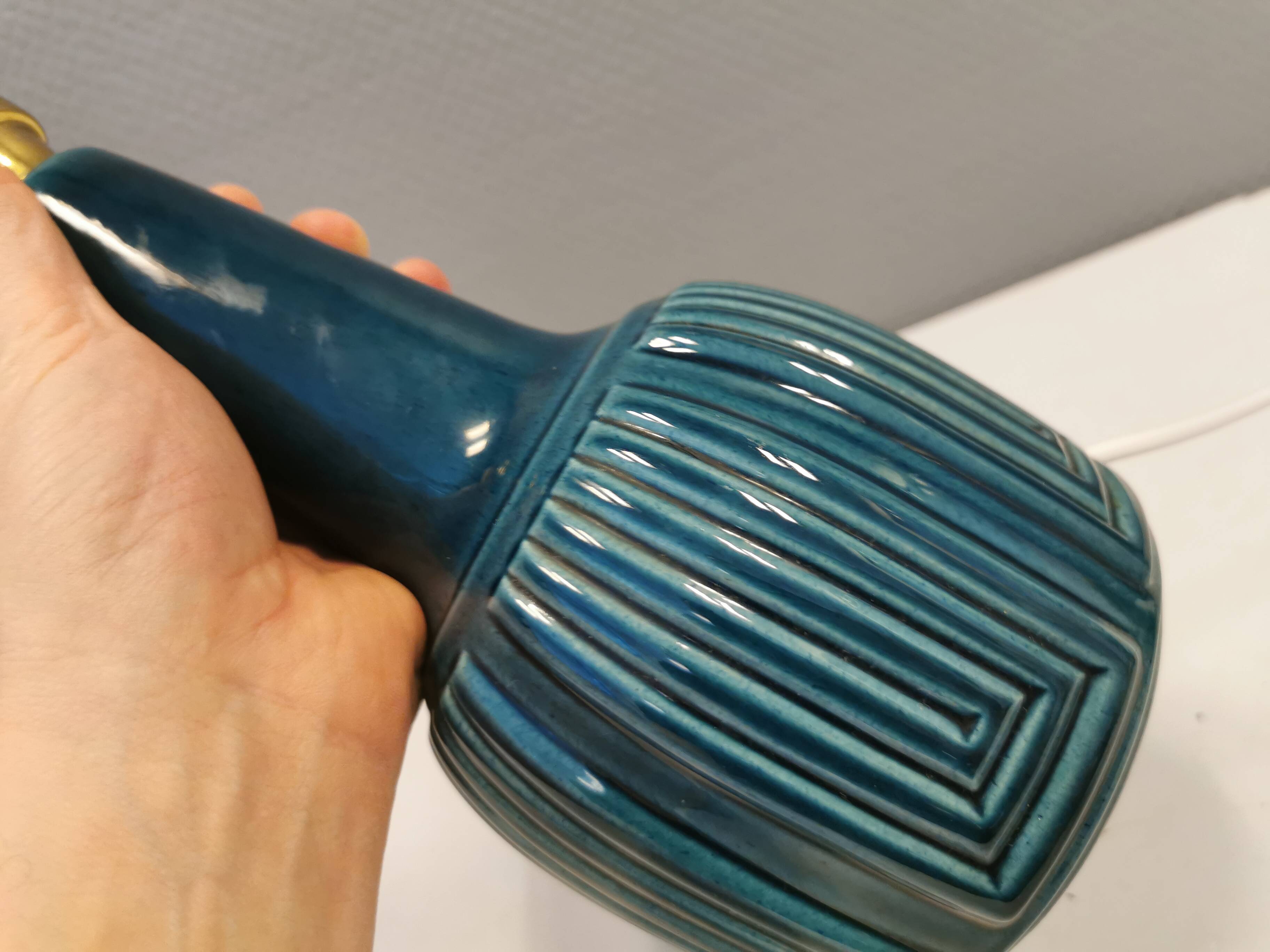 Elegant mid-century ceramic table lamp with an embossed pattern covered in mother-of-pearl glaze.