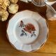 Vintage bell and its Digoin plate