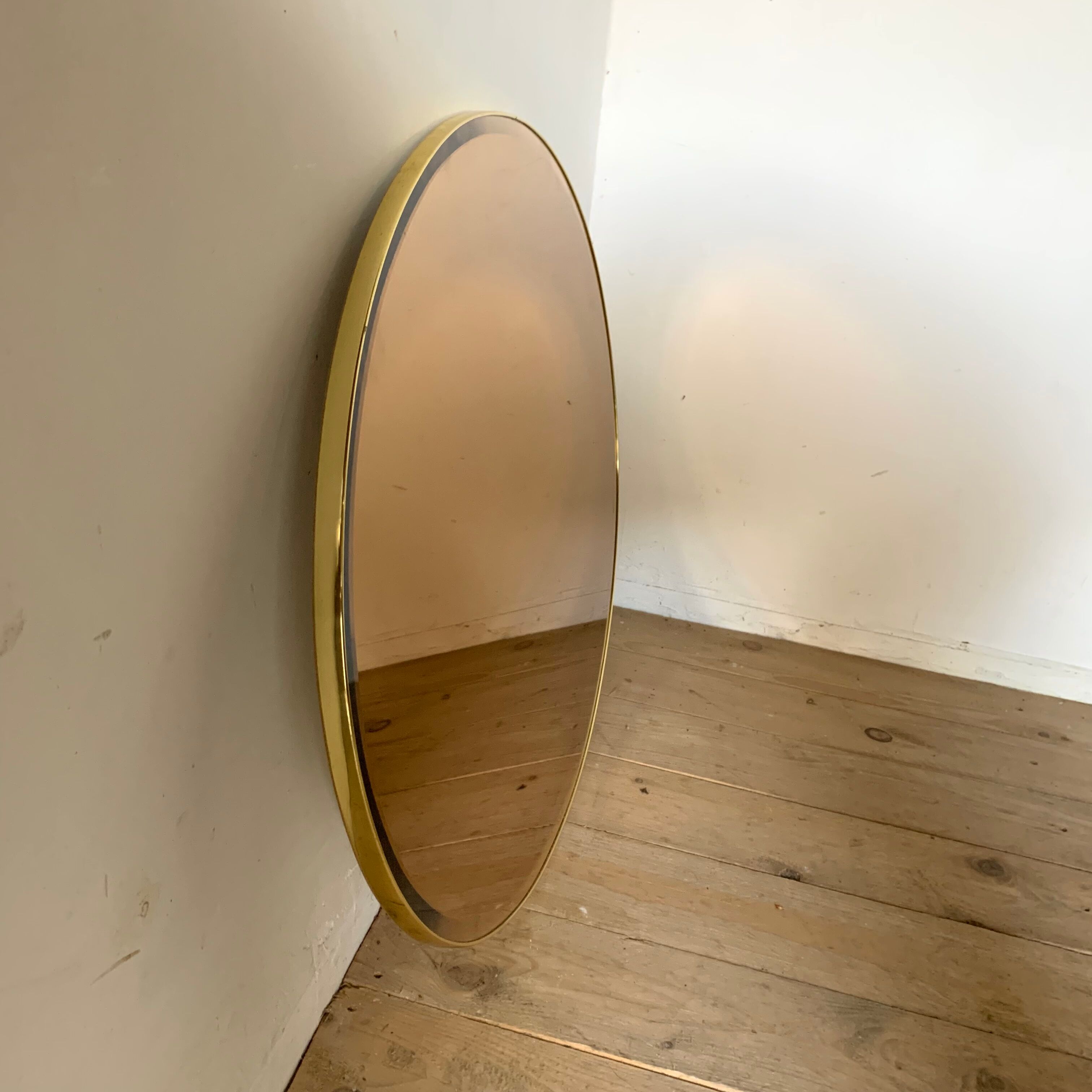 Vintage smoked oval wall mirror