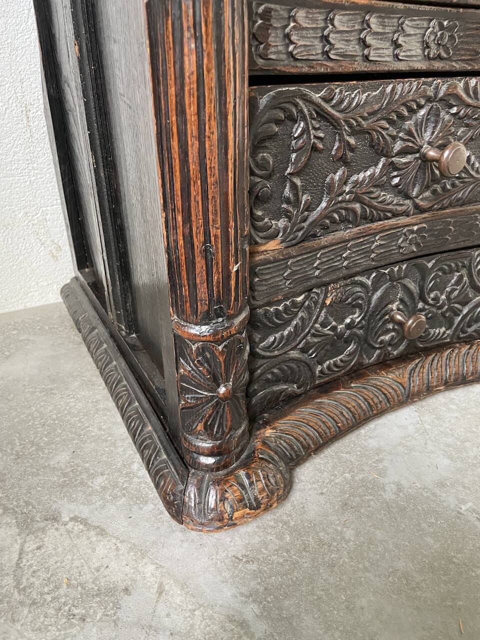19th century chest of drawers in carved blackened pine