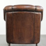 Vintage sheepskin armchair with a unique design and timeless appearance