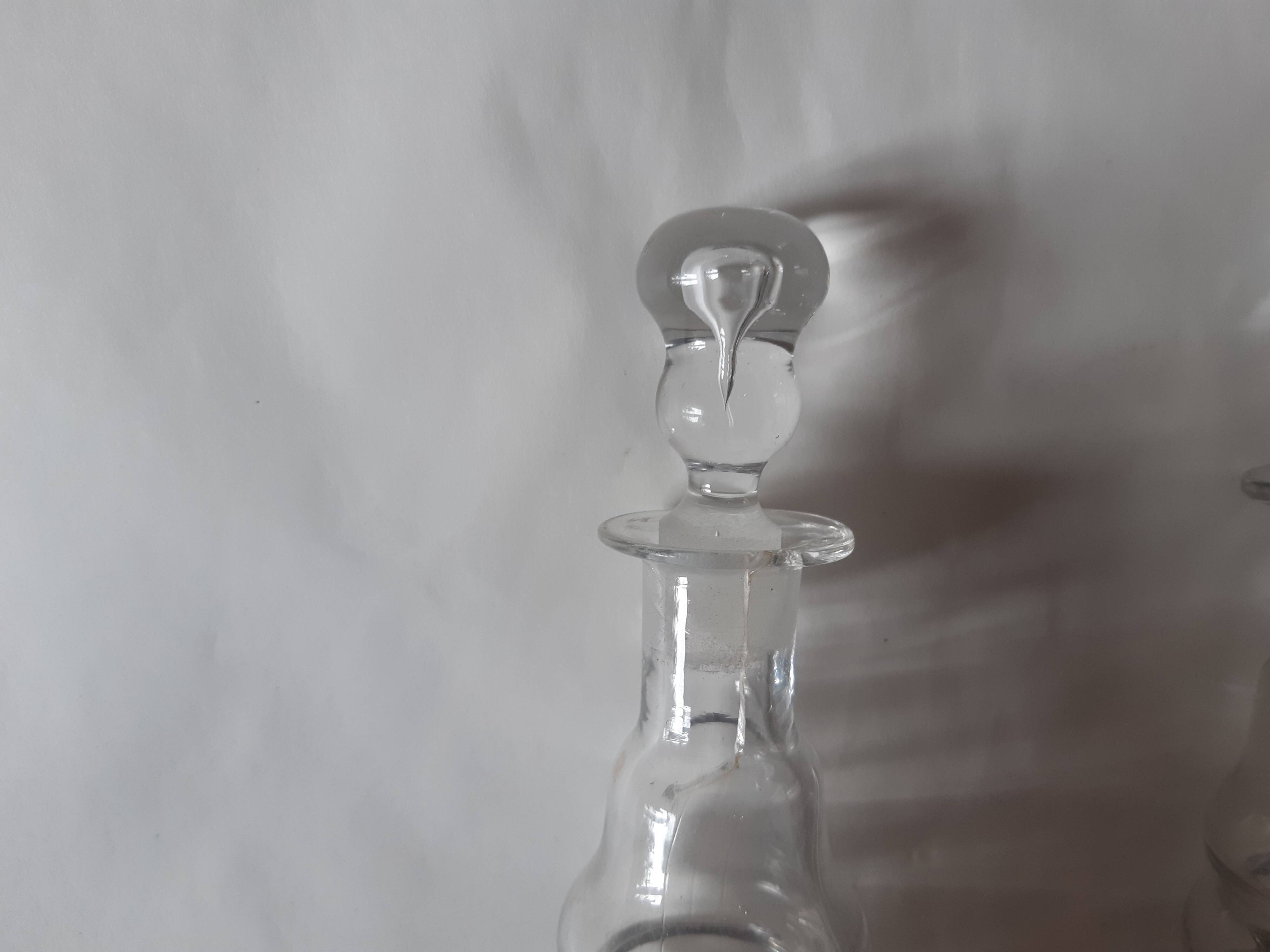 Set of two oil and vinegar glass cruets.