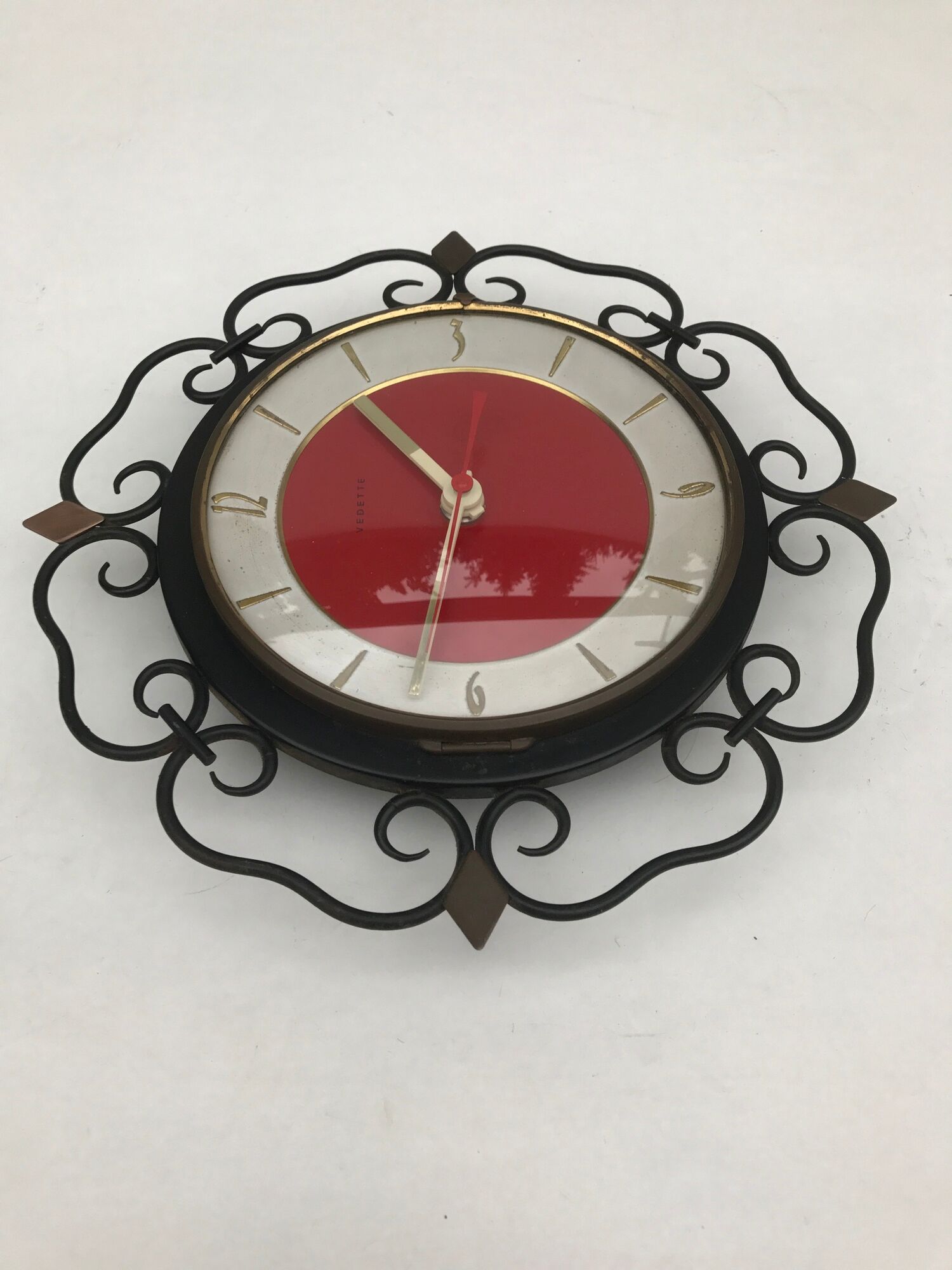 Pendulum clock old featured in metal and vintage copper spikes