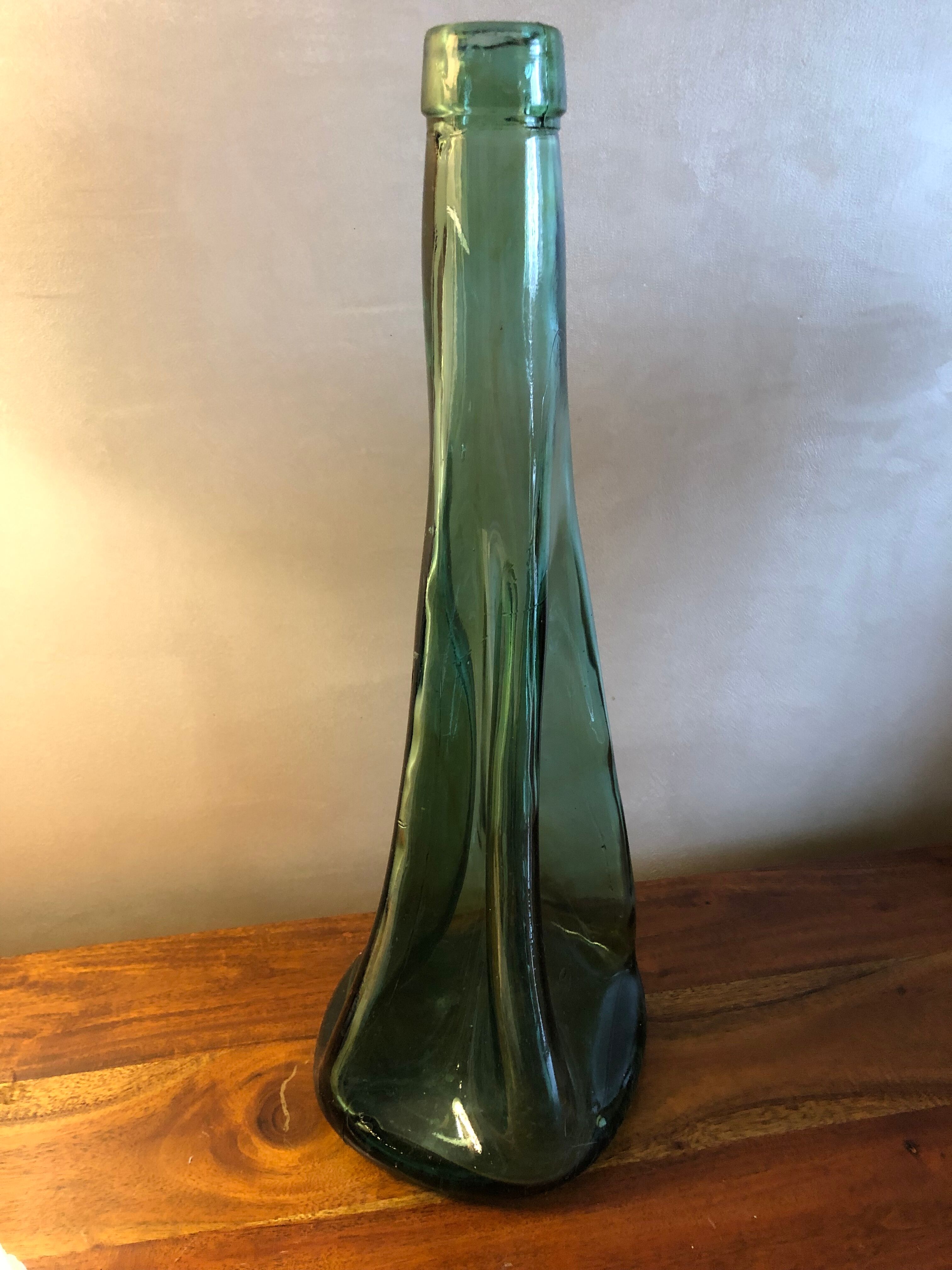 Large free-form green blown glass bottle