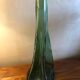 Large free-form green blown glass bottle
