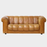 Mid century 2.5 seater sofa in thick cognac buffalo leather, 1970s.