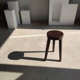 Small high tripod stool in brown solid wood