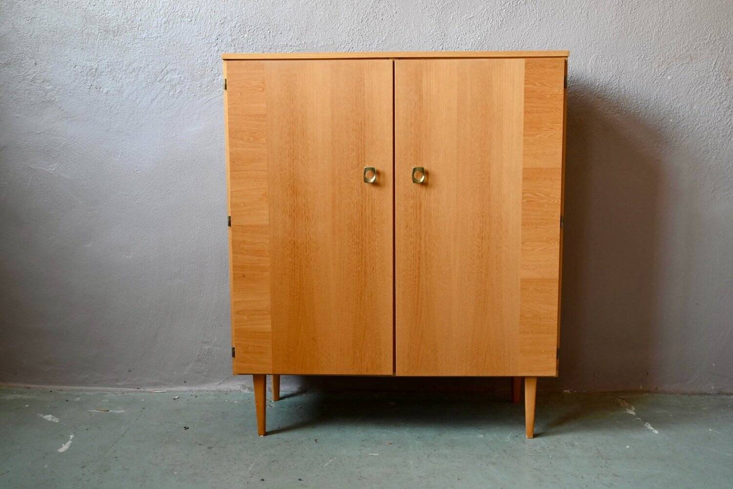 Vintage 1960s shoe cabinet in light wood and chrome metal.
