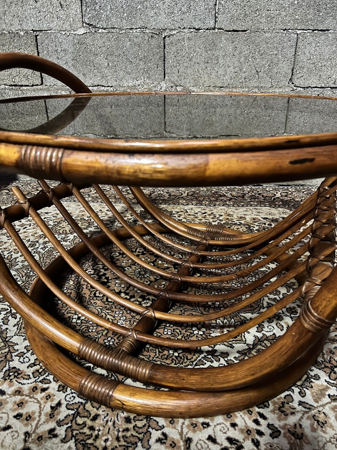 Vintage round coffee table in rattan and smoked glass