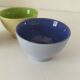 Set of three pastel two-tone mini bowls in glazed ceramic.