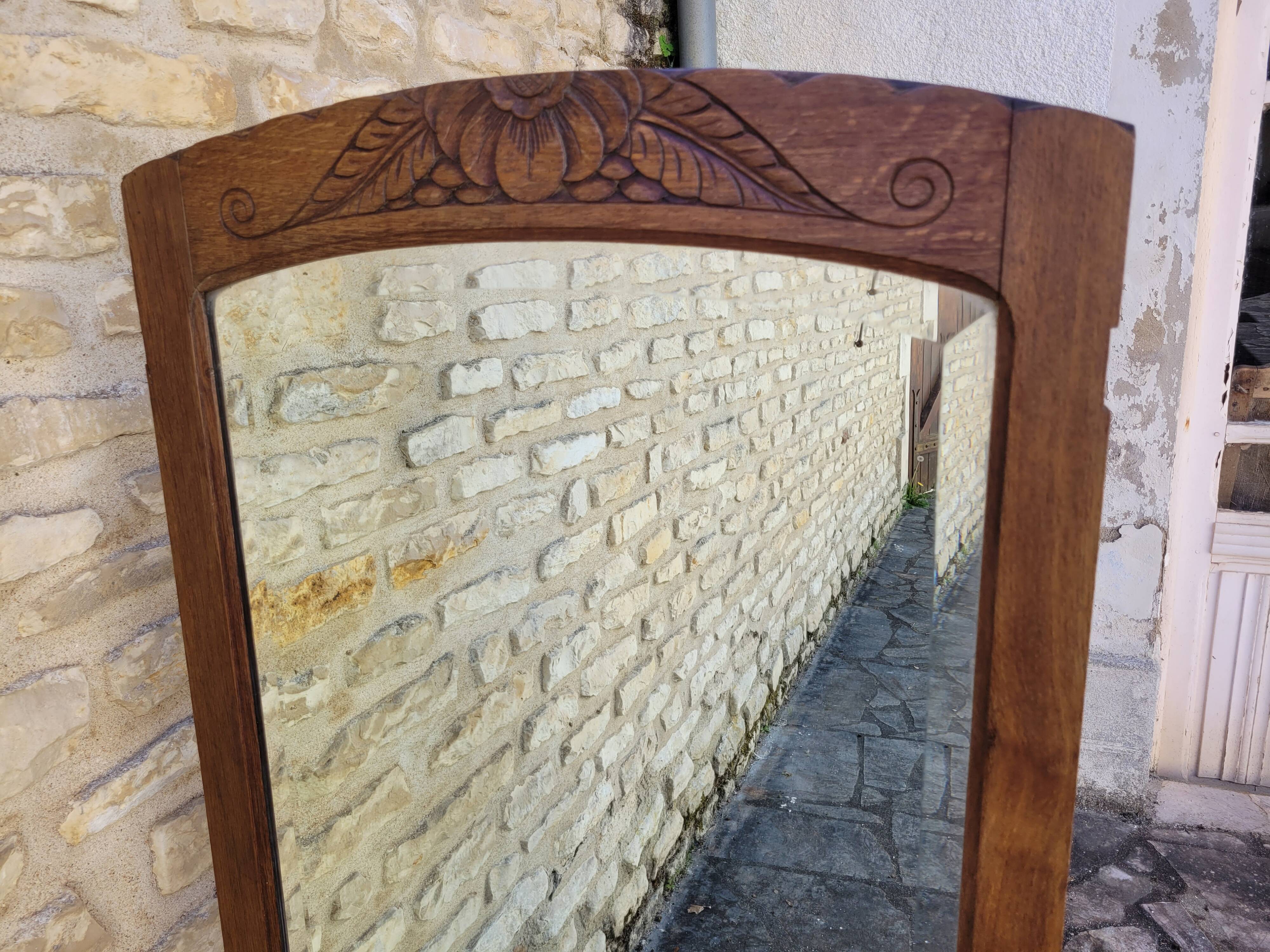 Art Deco oak mirror with bevelled glass from the 1930s.