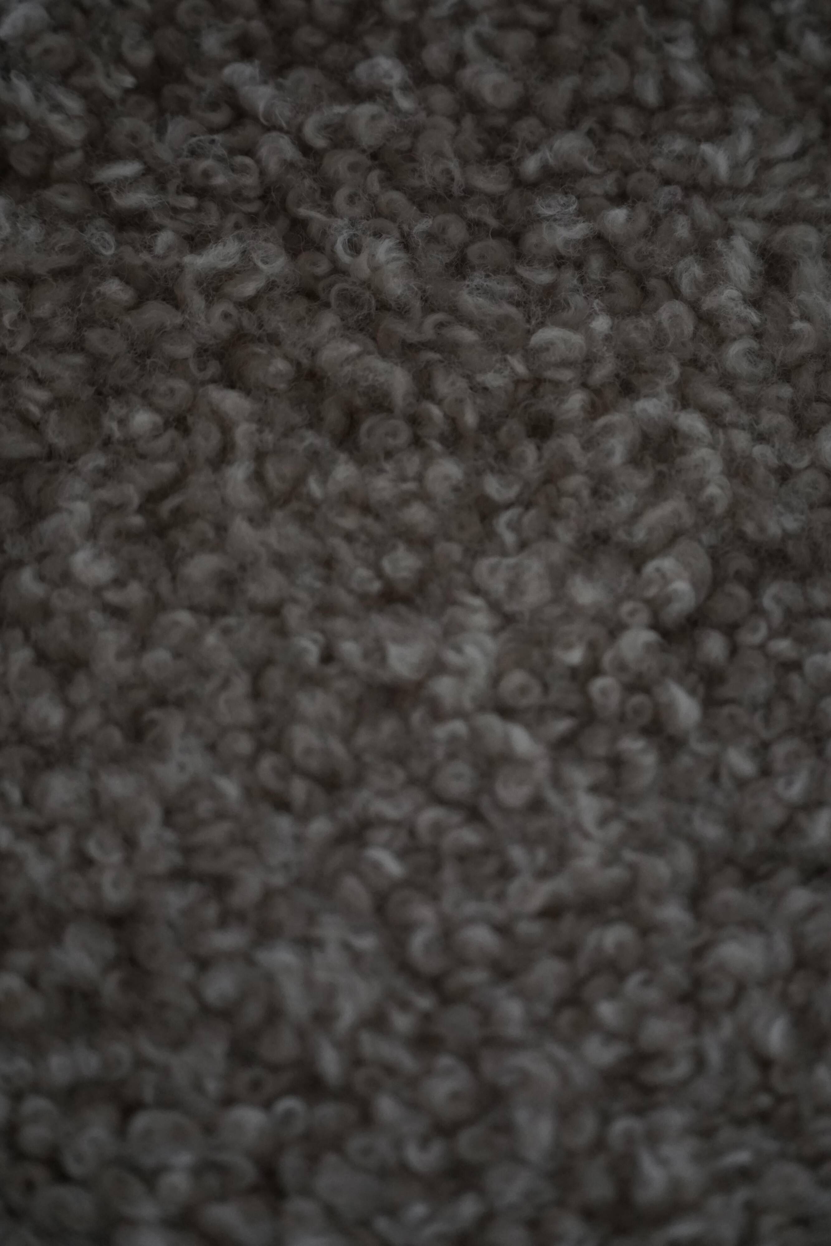 Henning Kjærnulf, Oak and lambswool armchair, "Kurul" model, Mid-century, 1960s