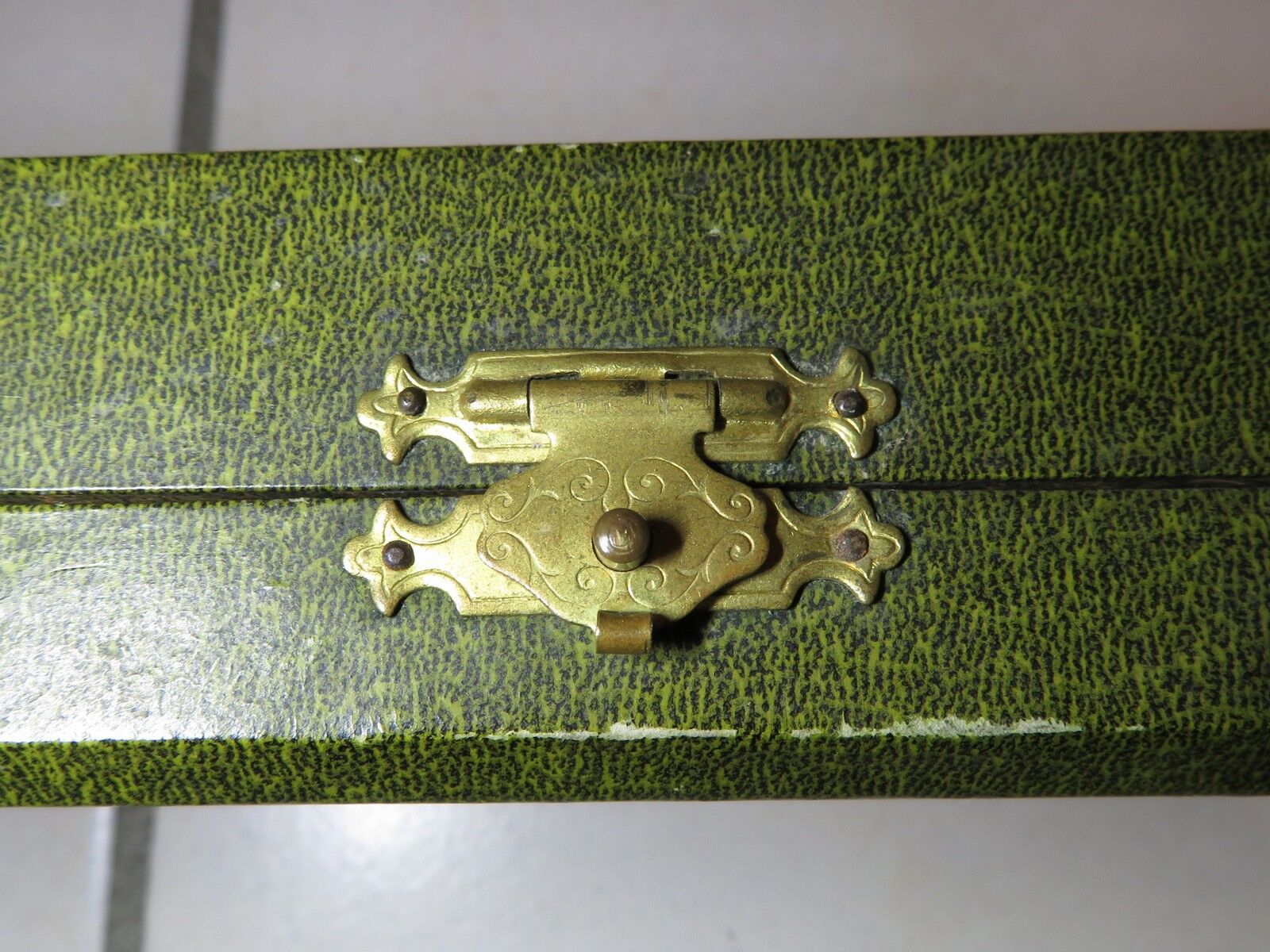 Silver salad servers stuffed in its case