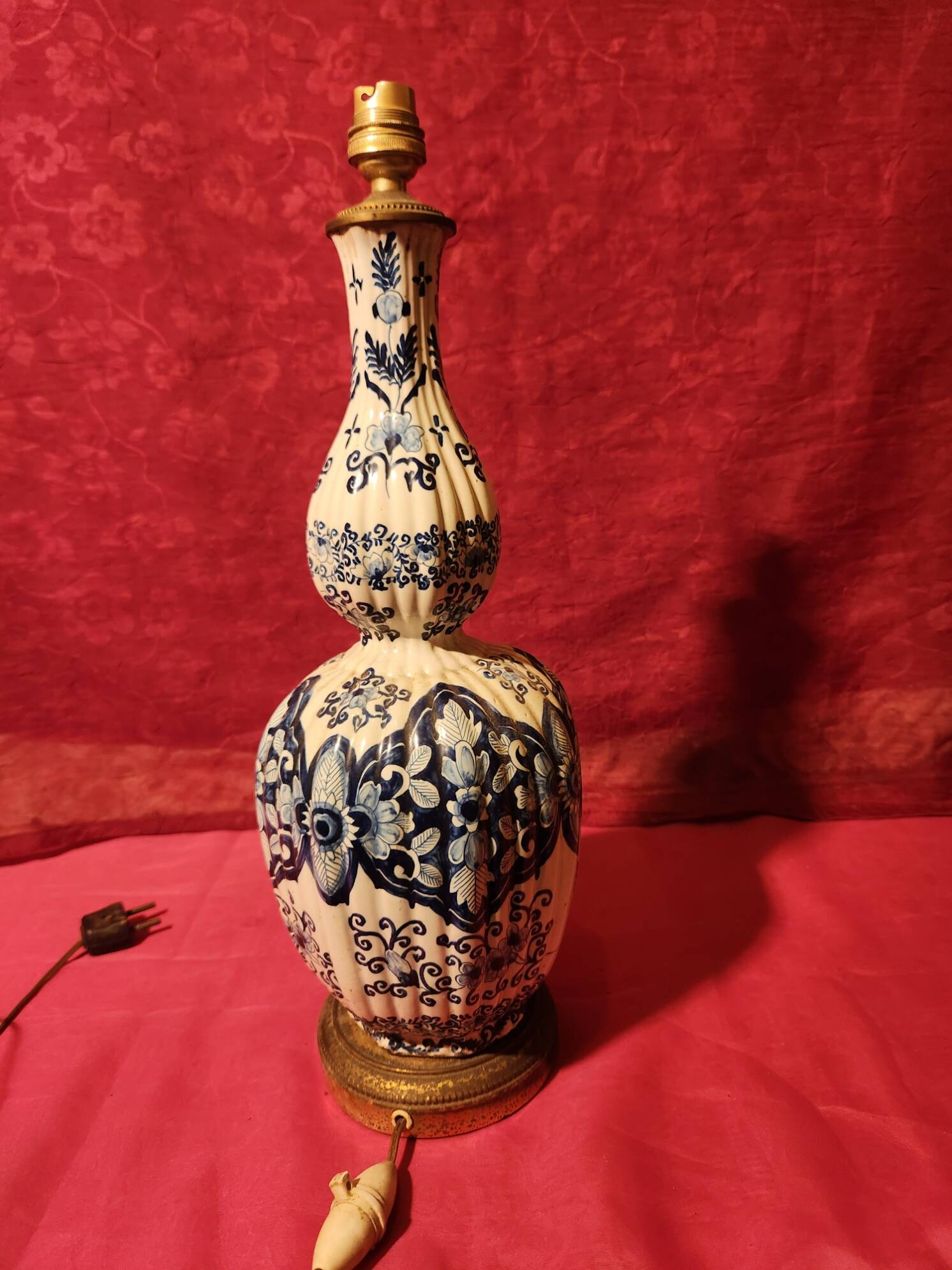 Antique ceramic lamp with brass or bronze base from the attic