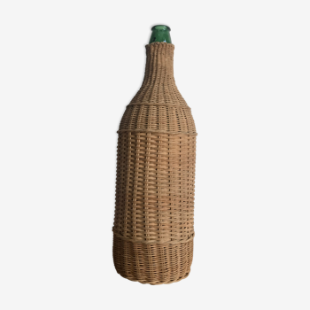 Green glass bottle and rattan