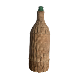 Green glass bottle and rattan