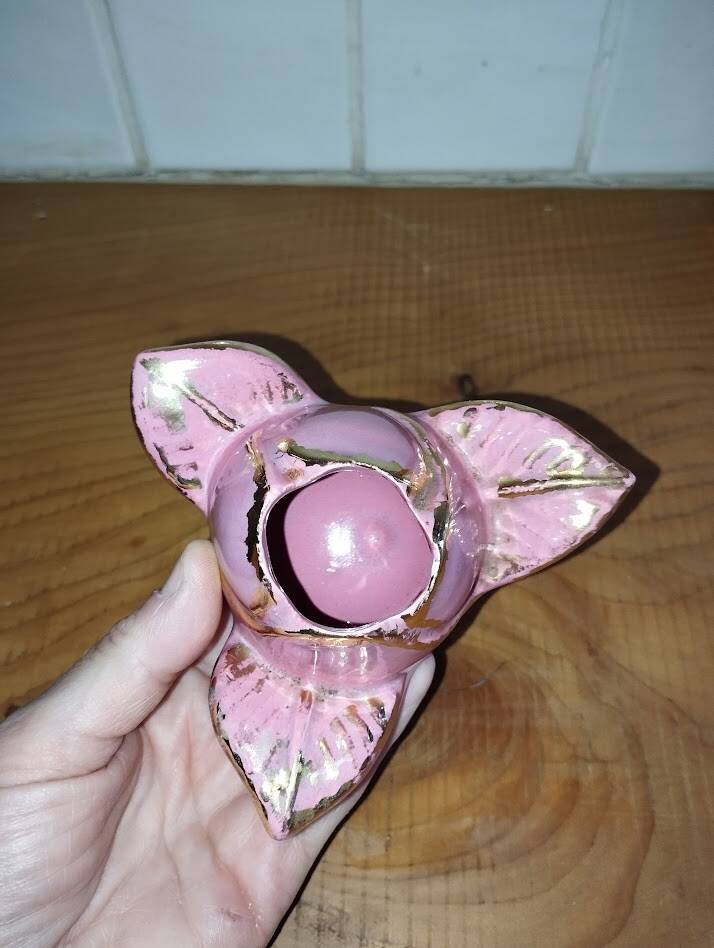 A pair of pink earthenware candlesticks (1940s–50s)