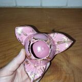 A pair of pink earthenware candlesticks (1940s–50s)