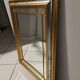 Mirror in gold and silver color