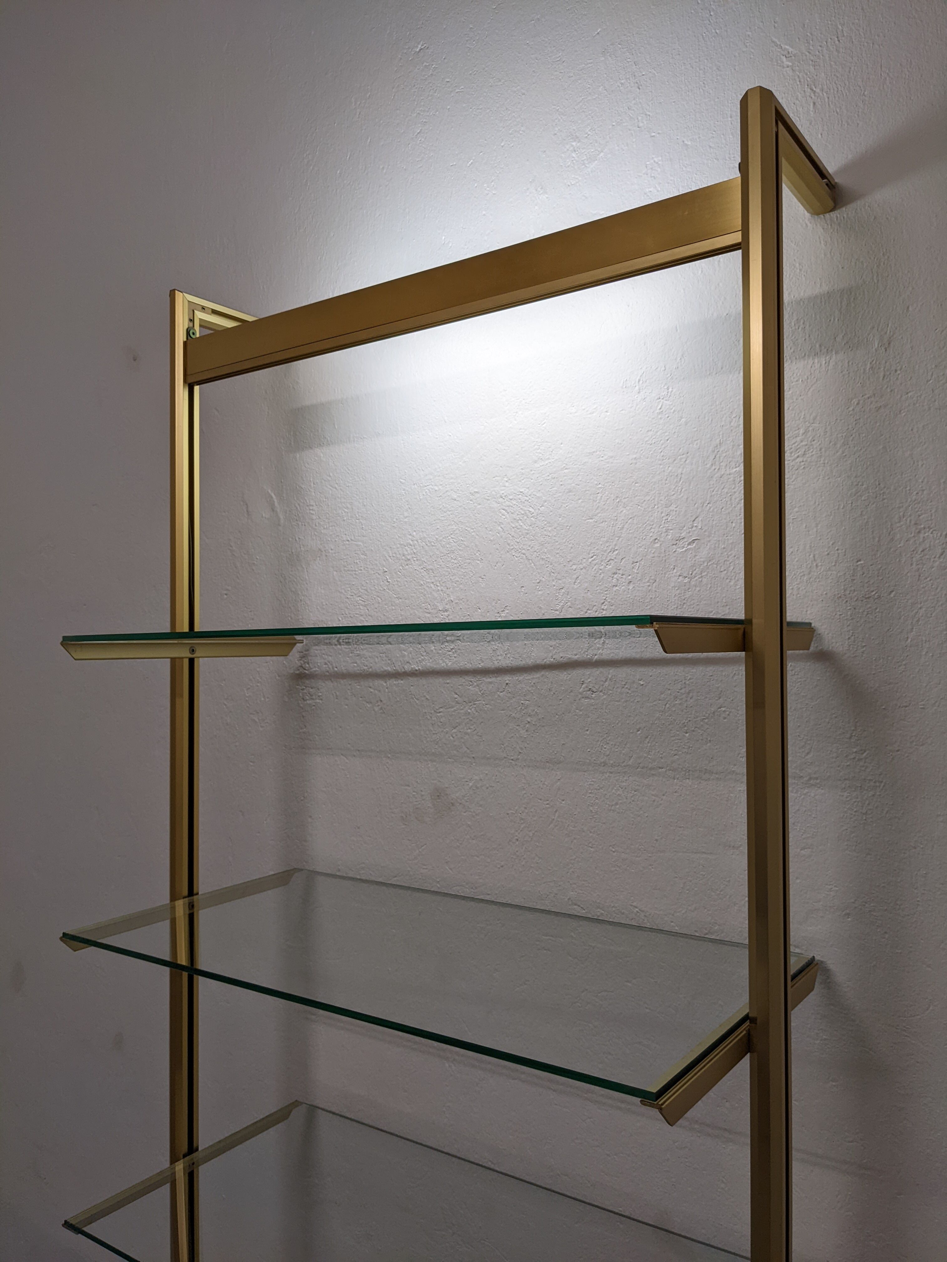 Modular shelf in glass and gilded aluminum from the 70-80s