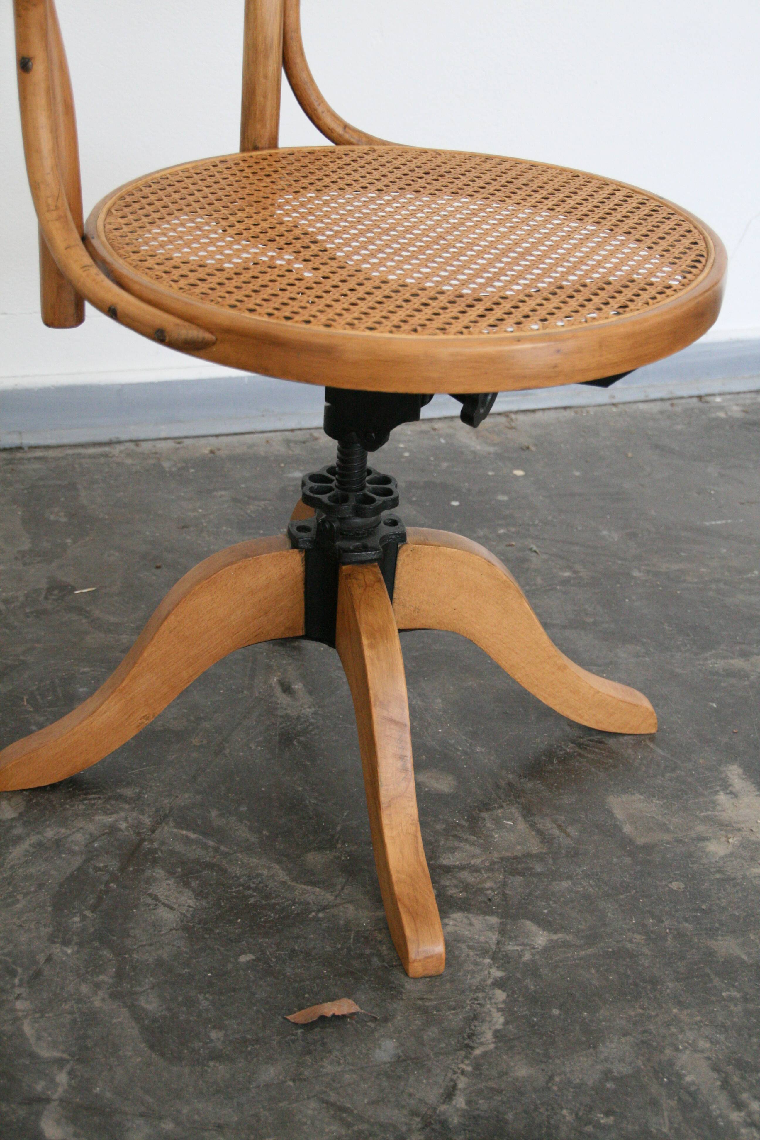 A pair of vintage bent wood svivel chairs by Salvaatore Leone Italy