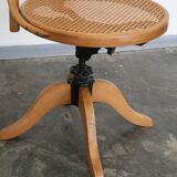 A pair of vintage bent wood svivel chairs by Salvaatore Leone Italy