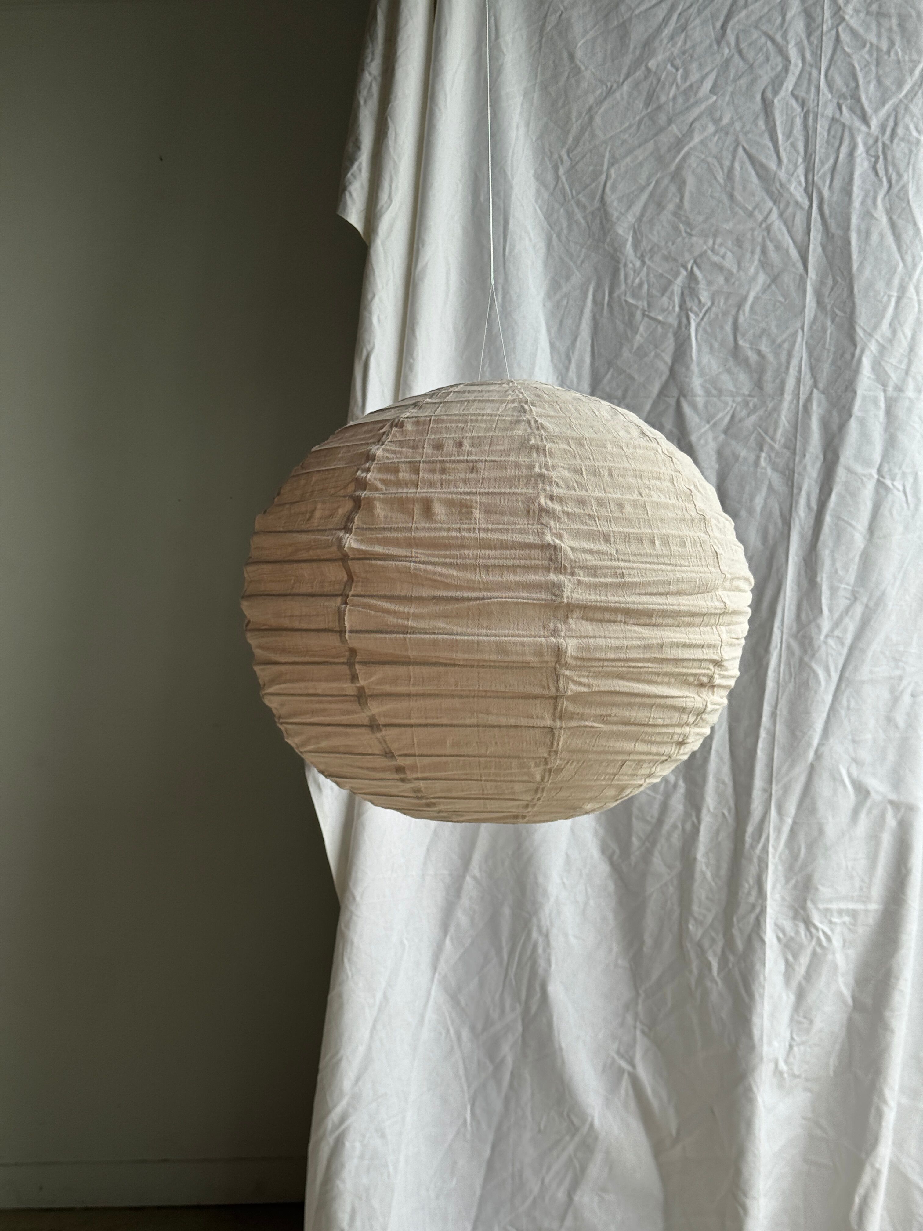 Large round pink Japanese-style suspension made of rattan and natural linen D60.