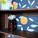 Caned cabinet with oranges