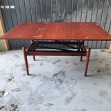 Vintage coffee table with Scandinavian rise and fall system in teak