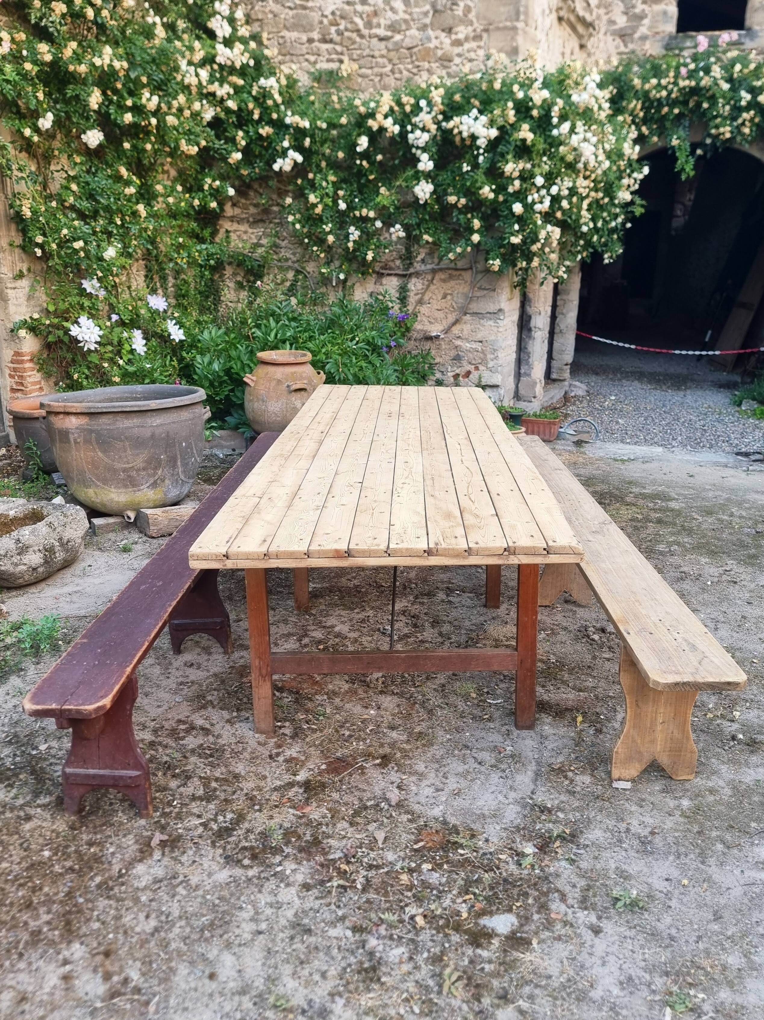 Antique French folding garden table set with benches, pine and chestnut, circa 1900–1920.