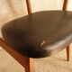 Pair of modernist Scandinavian chairs in teak and black faux leather.