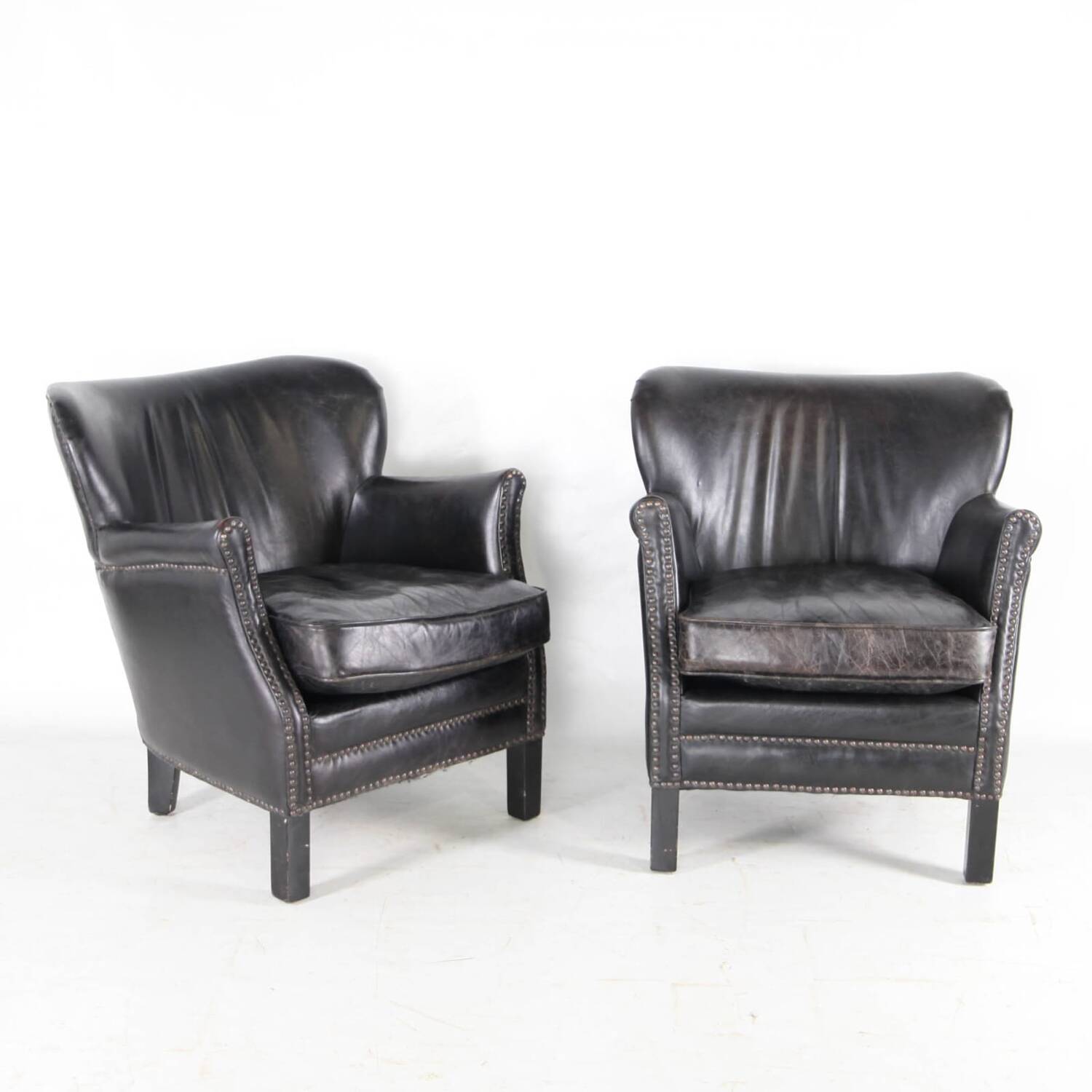Pair of small leather club armchairs