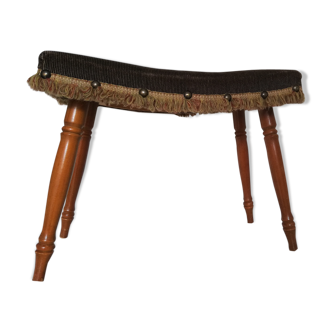 Stool with studs and fringes