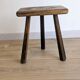 Antique tripod stool in patinated solid wood