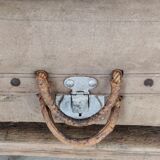 Old suitcase in canvas, wood and metal