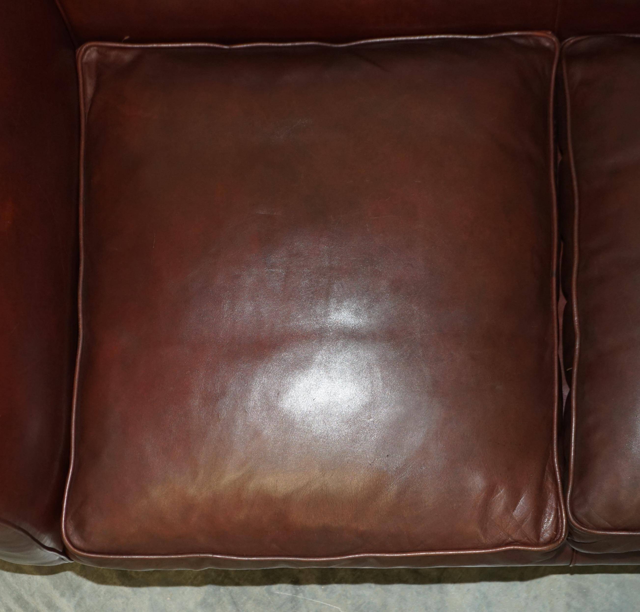 Vintage Art Deco leather sofa, three-seater, feather cushions.