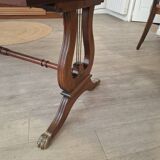 English desk in solid mahogany with lion paws. Leather top