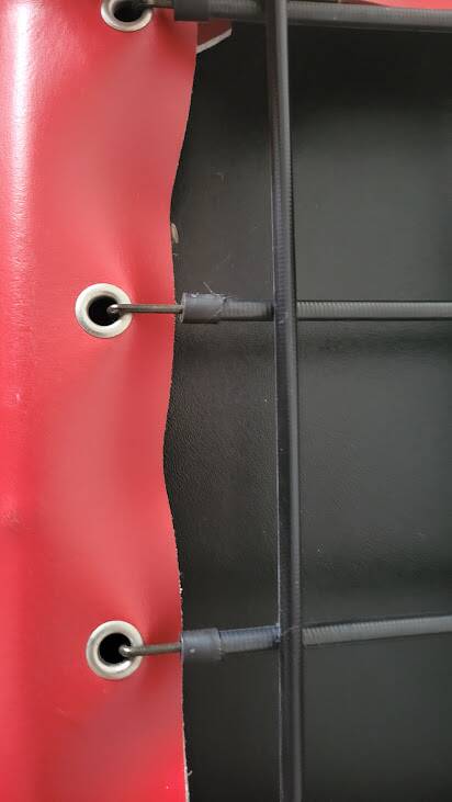 Red leather dining chairs by Arper