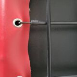 Red leather dining chairs by Arper