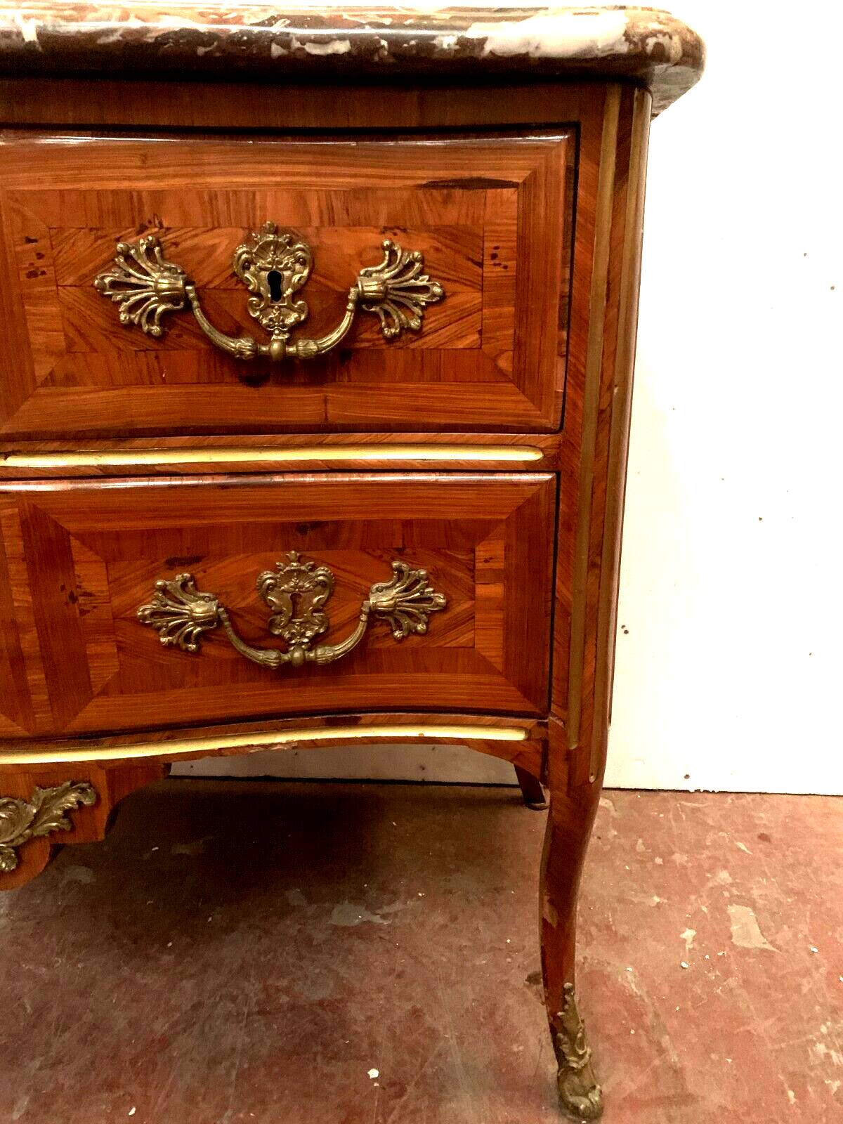 Louis XV saute chest of drawers with curved facade 18th century