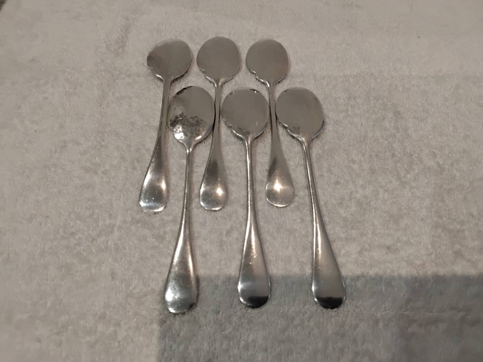 6 individual silver-plated metal sauce spoons with hammered baguette handles