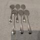 6 individual silver-plated metal sauce spoons with hammered baguette handles