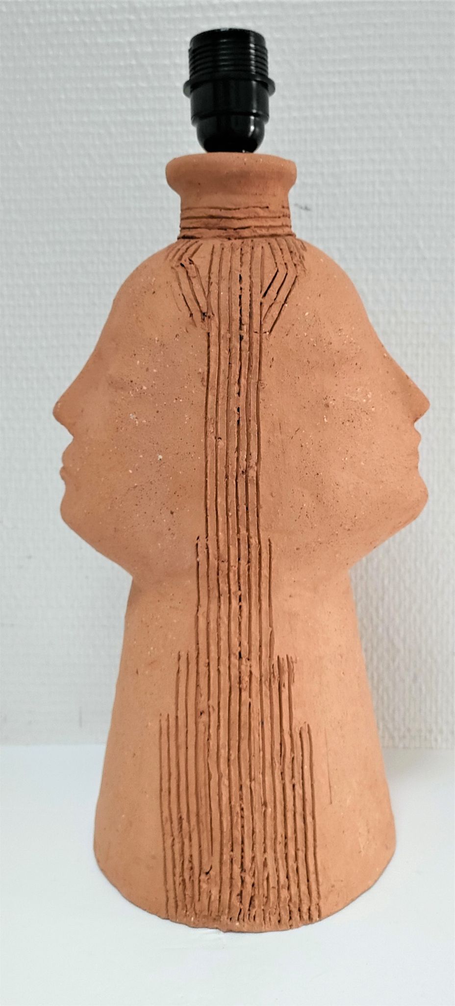 Anthropomorphic lamp foot depicting two faces terracotta design 80s
