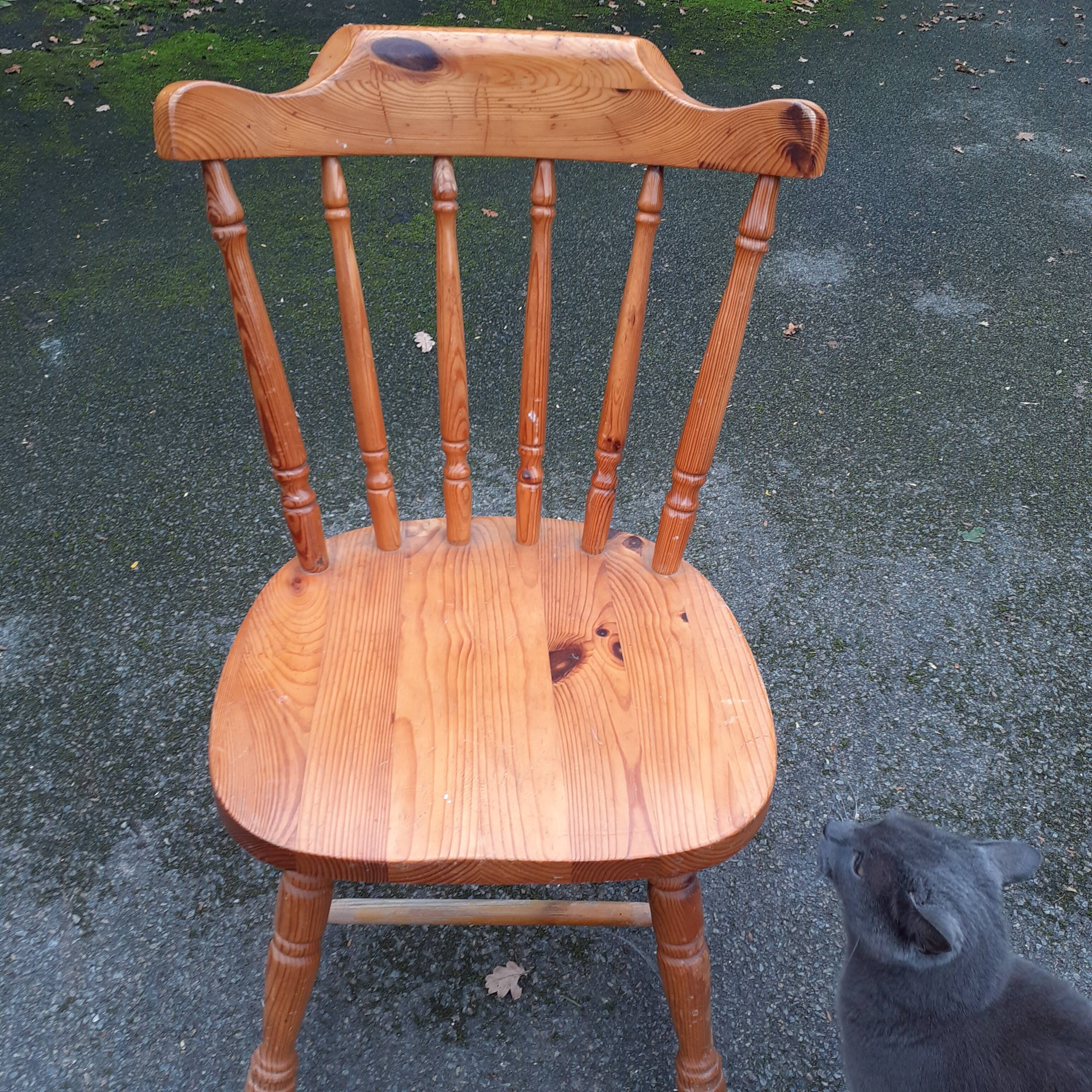 Light-coloured wooden american armchair