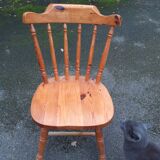 Light-coloured wooden american armchair