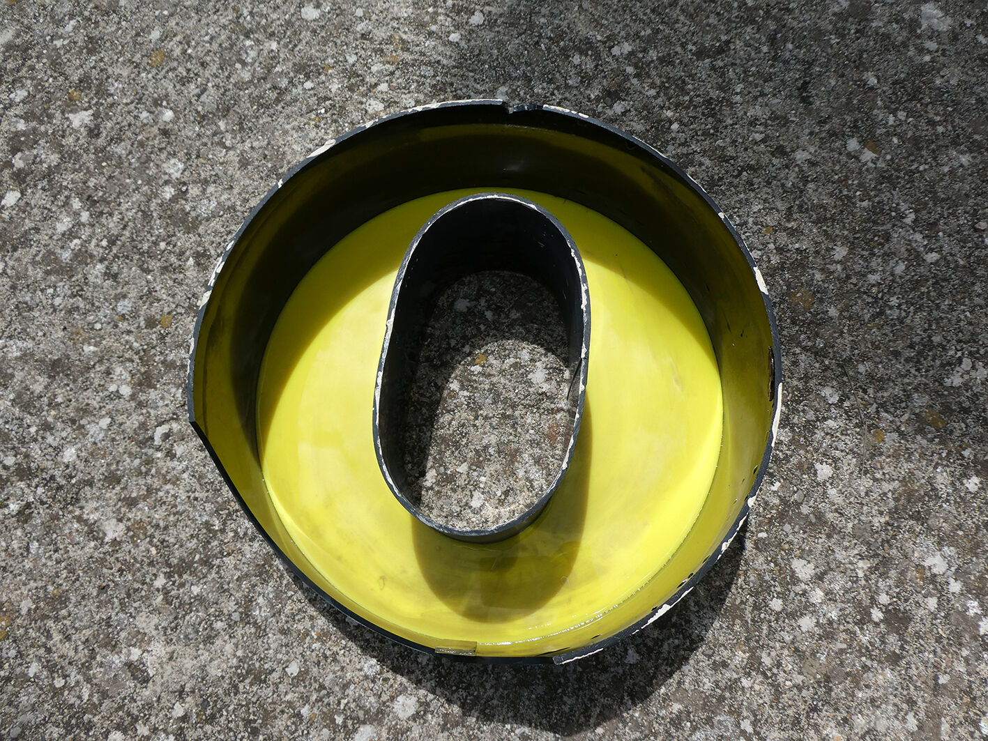 Letter "O" of industrial sign yellow and black