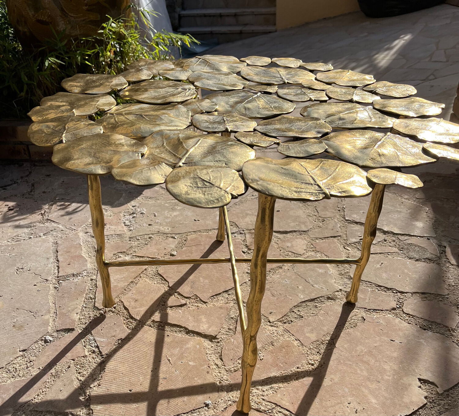 Carved brass coffee table with ginkgo decor