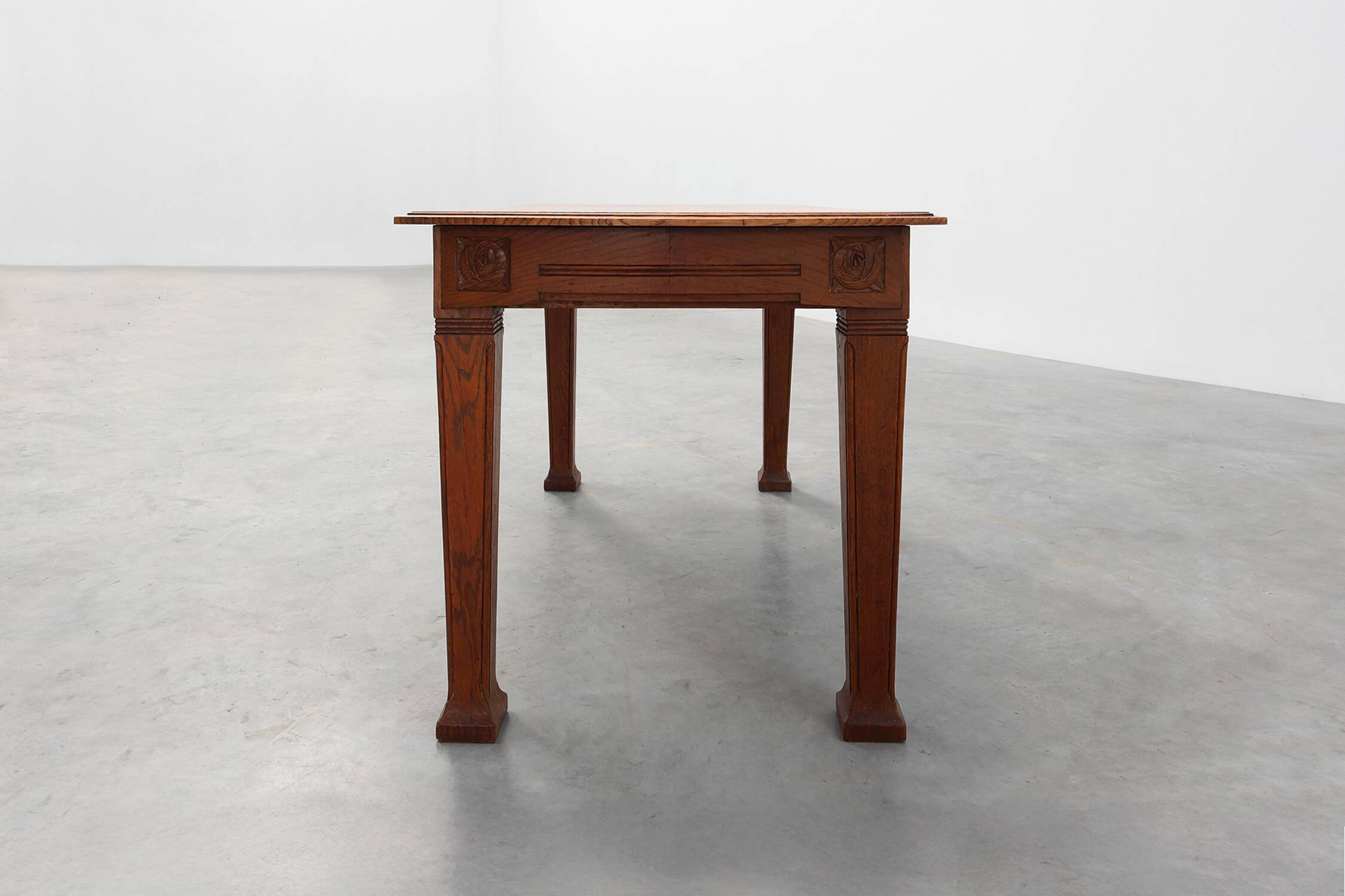 Oak Art Deco dining table with carved frieze, France 1920s